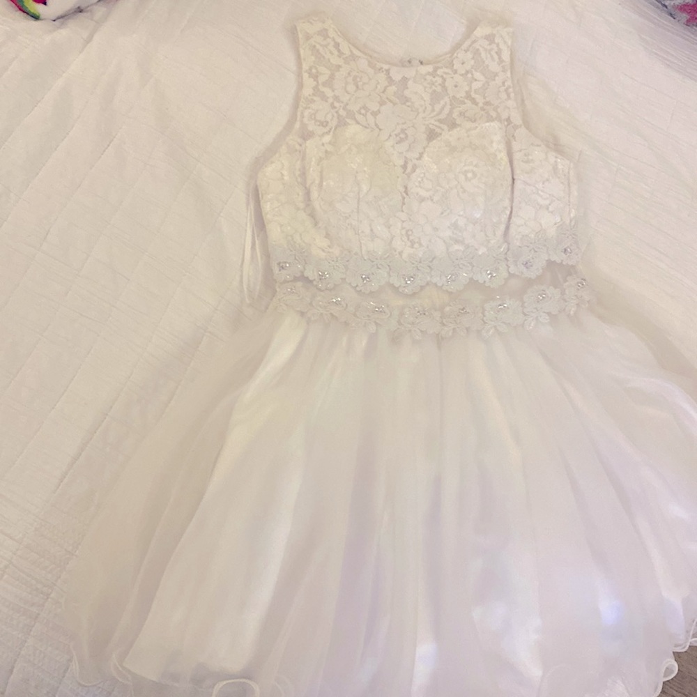 Dress.  Dressy elegant tight fit on top loose fit bottom (puffy) knee high